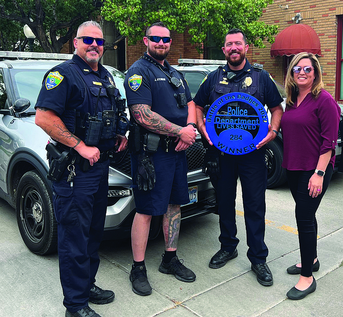 The Fallon Police Department won the Battle of the Badges last year. From left are Mike Woolf, Josh Atchison and Jose Perez. Shannon Perez, right, is one of the organizers and a member of Ladies Behind the Badge.