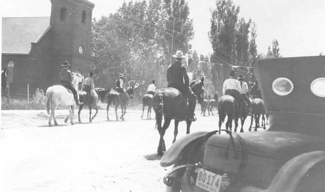 The Fourth of July 101 years ago was the largest ever in Gardnerville up to that date, according to The July 7, 1922, Record-Courier. In this photo of the mounted entry in the parade you can see the former Catholic Church, which still stands in town today.
 Photo courtesy of the Douglas County Historical Society