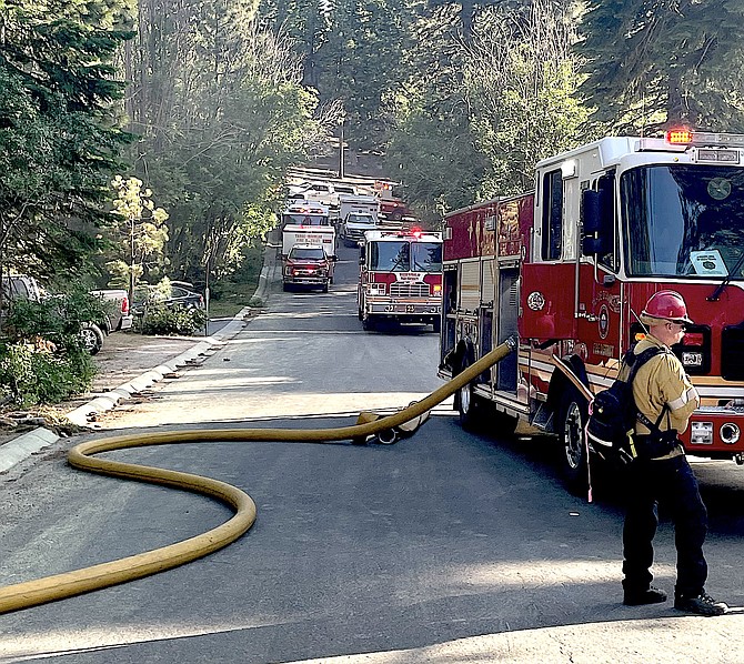 Tahoe Douglas firefighters battle a house fire on Tuesday evening.
