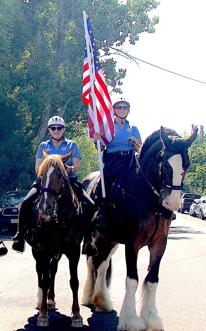 The Douglas County Sheriff's Mounted Posse rode through Minden in memory of member Tom Stone.
