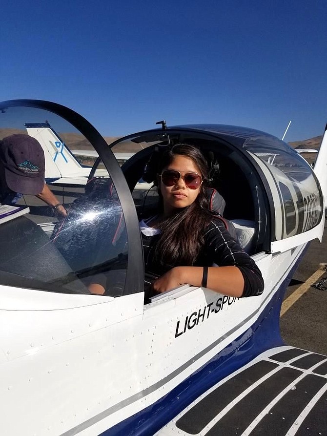 Luz Sandoval takes a flight on Aug. 24, 2018, at the Carson City Airport with instructor Paul Hamilton in a Sling 2 sport plane.