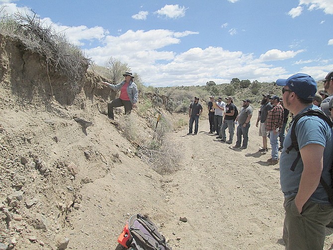 University of Nevada, Reno, Professor Tamzen Stringham teaches students in the Rangeland and Fire Ecology Program how to determine the texture and characteristics of soil within each soil horizon, or layer. 
UNR Photo by William Richardson.