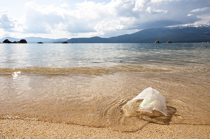 A plastic cup lays degrading on a Lake Tahoe beach near Incline Village on June 23.