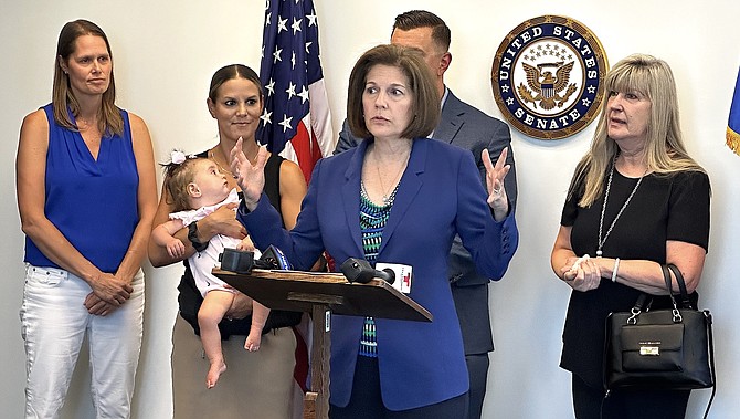 Sen. Catherine Cortez Masto, D-Nev., center, on Friday discusses the Jimmy Deal Trafficking Survivors Assistance Act with (from left) Awaken Executive Director Melissa Holland, Deal’s daughter, Jessica Dyess, Deal’s son, David, and his widow, Cathy.