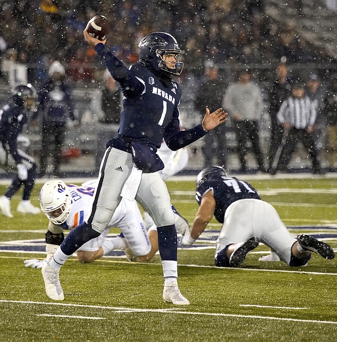 Shane Illingworth, shown against Boise State last season, is one of three quarterbacks expected to compete for the Wolf Pack’s starting role.