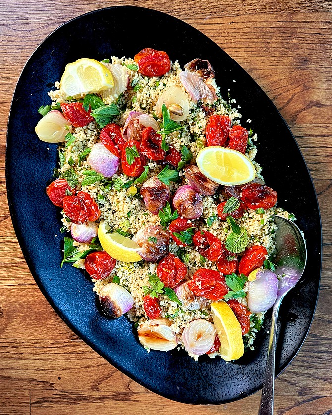 Couscous salad with blistered tomatoes and red onions.