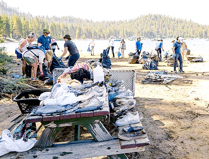 Keep Tahoe Blue volunteers work to clean up Zephyr Shoals Beach on July 5 after Fourth of July visitors left tons of trash.
League to Save Lake Tahoe Photo