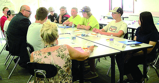 Churchill County Manager Jim Barbee shares career advice with participants of the Churchill County High School summer internship School to Careers program. Clockwise from bottom left, are Sue Segura, Carter McBee, Barbee, Jackson Barbee, Gerik Wassmuth, Erik Duenas, Jose Vicenci, Darius Paolini, Travis Fullbright, Mathias Loop and Coral Escartin.