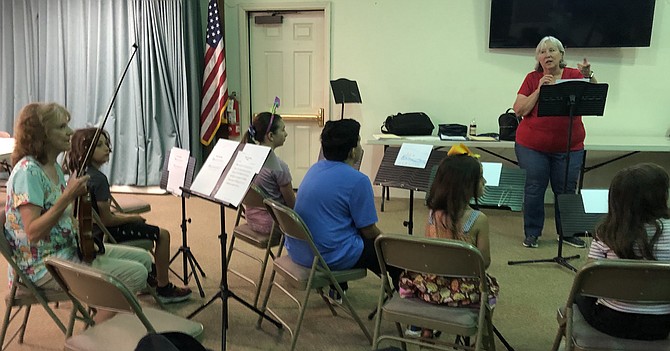 Instructor Suzanne McGarraugh leads "Strings in the Summer" program.
