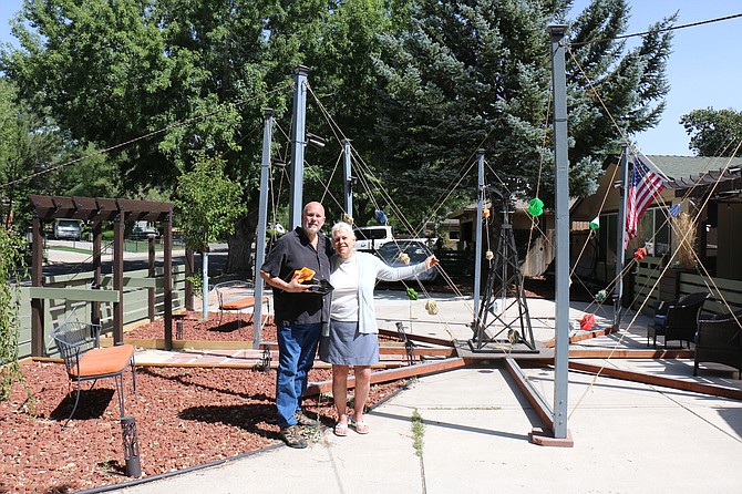 David and Debbie Lambin with “The Octagon” in front of their west Carson City home on Aug. 4.