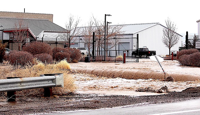 Flood waters pour past the Town of Minden Maintenance Yard during a second round of flooding in March.
