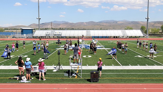 Carson High School’s Blue Thunder marching band practices a set during band camp Aug. 3. This year, the band will premiere custom-written music by composer Gary Gilroy.