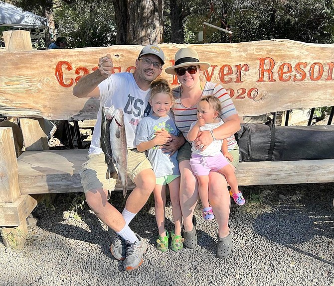 Gardnerville residents Chris, Brittany, Madeline and Emily McRae with two fish they caught in Silver Creek with Night Crawlers. The big fish was 21 inches and 4.2 pounds and the smaller one was 2.04 pounds.