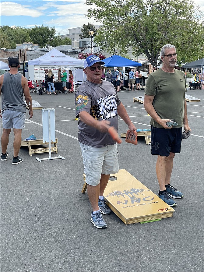 Minden resident Bill Merrill, left, and Fresno-resident John Fent practicing throws at the Hopefest cornhole tournament on Aug. 11.

Photo by Scott Neuffer/The Nevada Appeal