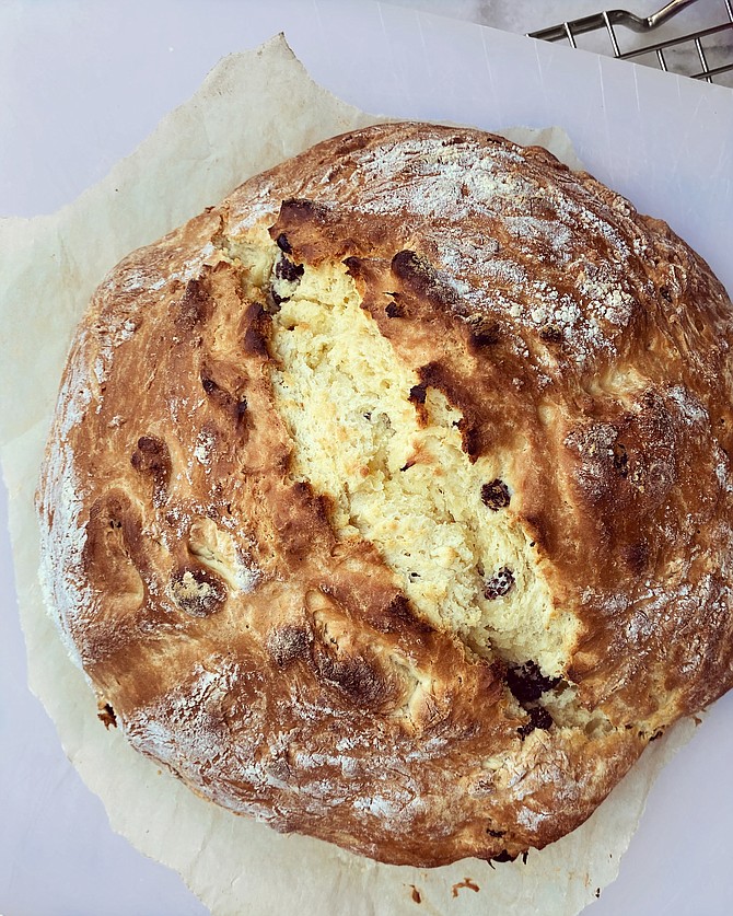 Irish soda bread is a quick bread, which means it doesn't require any yeast or kneading to rise. Instead, it relies on baking soda and buttermilk, which interact for leavening.