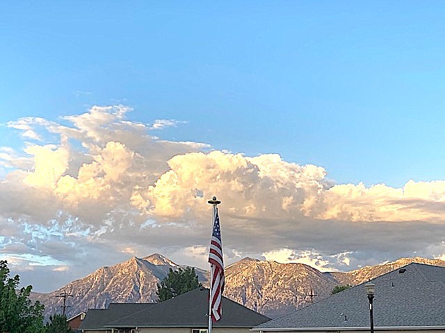 Clouds are already forming over the Sierra this morning in this photo by Valley resident Reggie Mueller as the chances for showers or thunderstorms increase today.