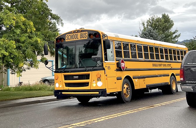 A bus rolls down County Road on Monday morning for the first day of school.