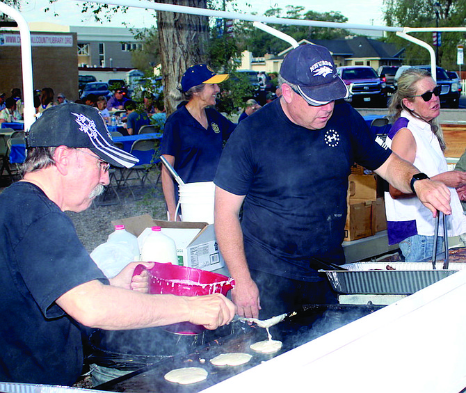Stuart Richardson and Lane Mills cook pancakes at the Rotary Club of Fallon pancake breakfast last Labor Day.