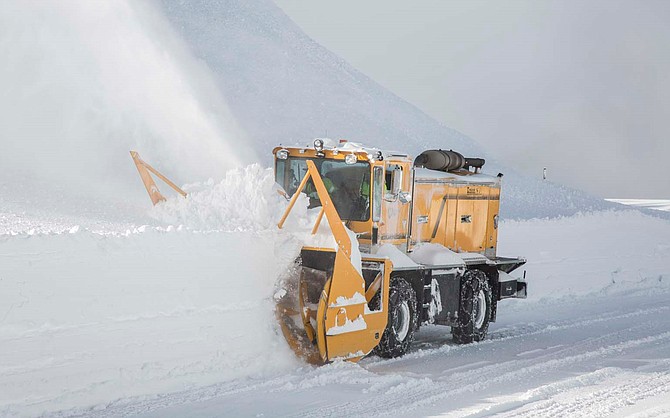 A snowplow clears the Mt. Rose Highway after an avalanche triggered by the avalanche control system.