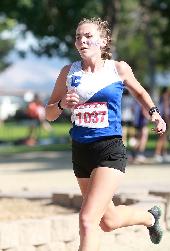 Carson High’s Jinnie Ponczoch races toward the finish at Lampe Park on Friday during the Douglas High Class Races.