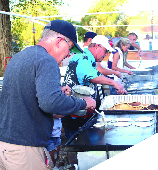 Fallon Rotary Club members prepare breakfast one year ago on Labor Day. The annual breakfast next to the Churchill County Library is Monday beginning at 7 a.m.