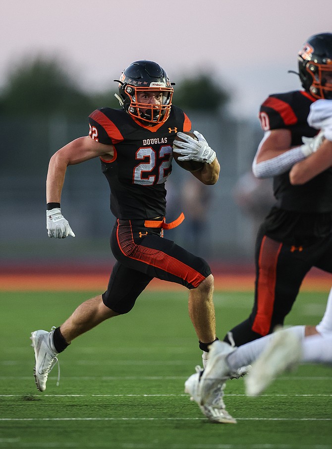 Connor Jackson takes a handoff against Elko last Friday. Jackson and the Tigers bested Spring Creek, 31-0, Friday night on the road.