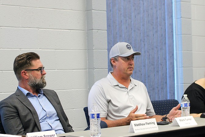 Matthew Fleming, executive director of Northern Nevada Community Housing, left, and Mark Turner, a local developer of market-rate housing, discuss ideas for affordable housing at a public workshop Aug. 30.
