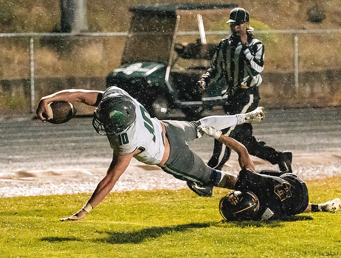 Fallon’s Baylor Sandberg stretches for the end zone, giving Fallon a 12-7 lead against Galena.