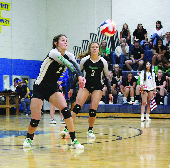Fallon senior Kiley Wallace passes the ball while teammate Reece Hutchings looks on in last week’s five-game win over Lowry to open the 3A season.