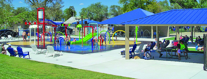 The community enjoys the Aug. 26 grand opening of the splash pad at Oats Park.