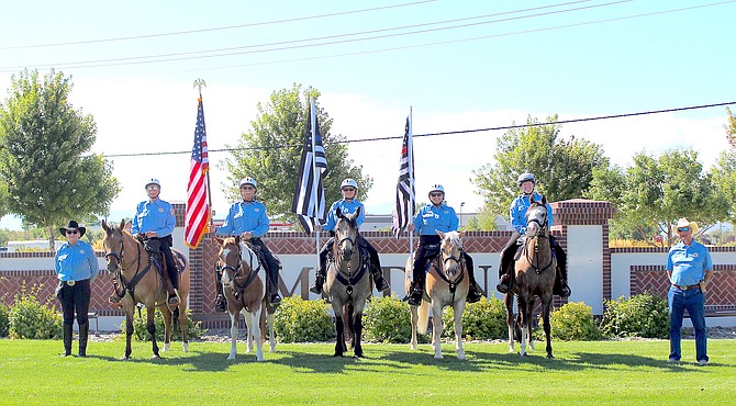 Members of the Douglas County Sheriff's Mounted Posse at the intersection of highways 395 and 88 on Monday morning in memory of the 9/11 attacks.