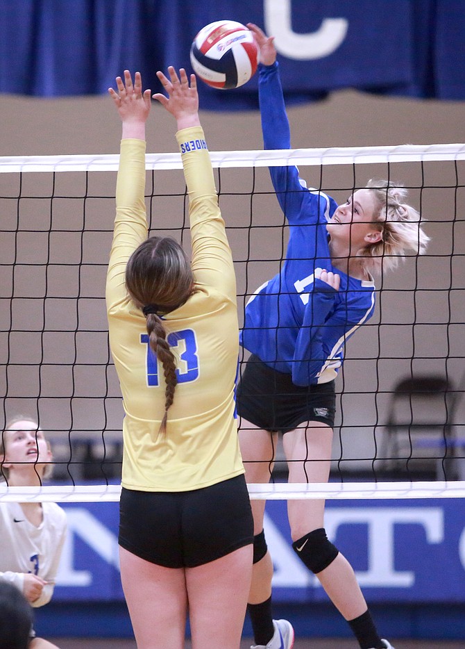 Carson High senior Dayna Myrehn connects with one of her 10 kills Tuesday night in a 3-0 win over Reed.