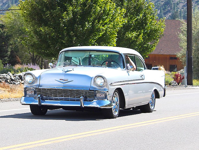 A classic silver Chevy Bel Air heads north on Jacks Valley Road on Saturday after the car show in Mormon Station State Historic Park organized by Shawn Klien.