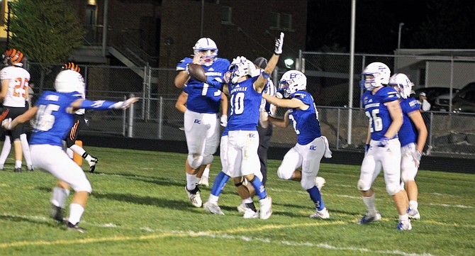 Eatonville senior Max Henley (10) celebrates with his team after recovering a Centralia fumble in the end zone for the Cruisers’ fifth touchdown.