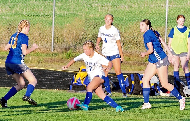 Eatonville's Haley Courson (7) weaves her way past Adna defenders in the Cruisers' 2-1 win.