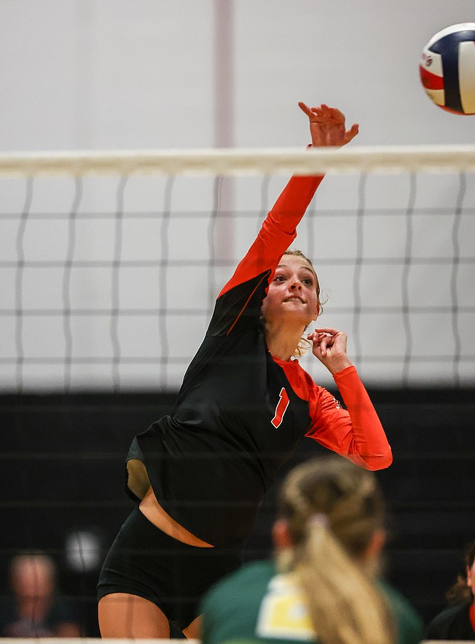 Douglas High senior captain Suzy Berger goes up for a kill against Bishop Manogue on Tuesday. Berger leads the team in kills so far this fall and will be a valuable piece for a younger Tiger squad.