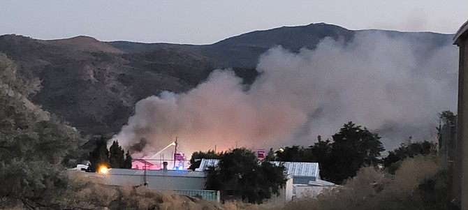Lyon County firefighters respond to a fire at the Kit Kat Ranch 7 miles east of Carson City Thursday night.