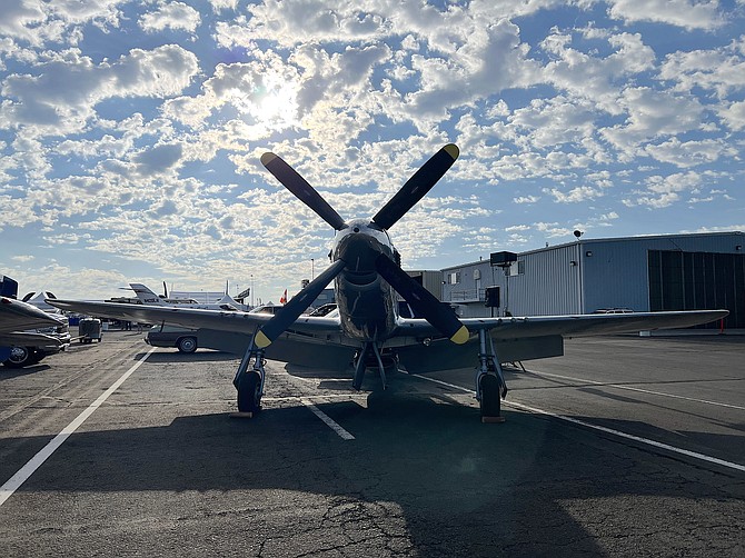 A P-51 sillouetted by the dawn for the last edition of the Reno Air Races.