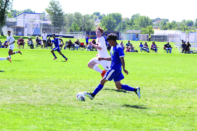 Lowry's Eric Quirarte throws the ball back in play against Fernley.