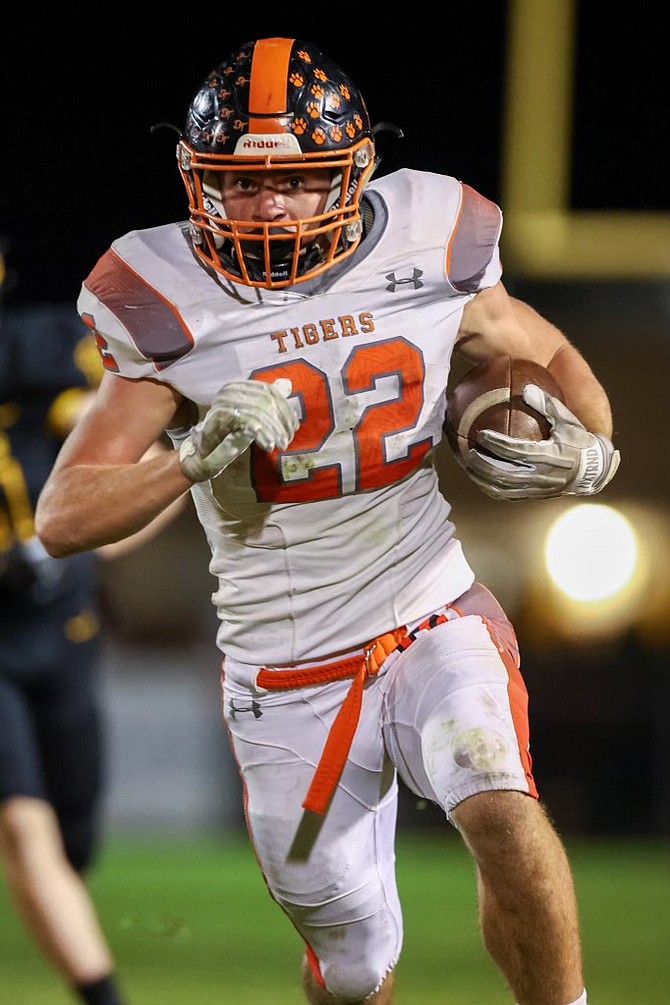 Douglas High running back Connor Jackson bolts for a large gain, during the Tigers’ 51-21 win over Galena Friday night. Jackson had 303 yards rushing and four scores in the victory.