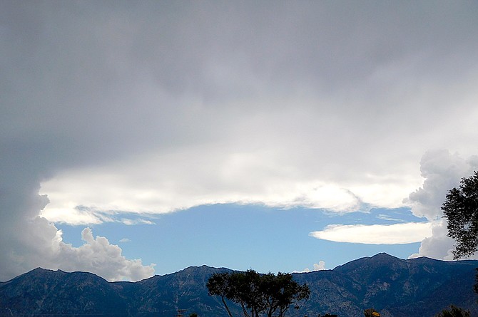 Storm clouds build over Sierra in this photo submitted by Kathy Chipman Wicker.