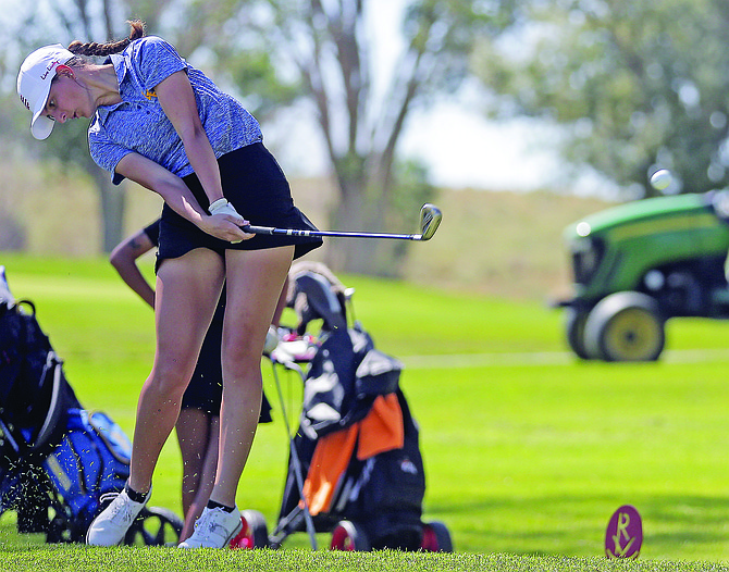 Lowry's Katie Cassinelli hits  drive earlier in the year in Elko.