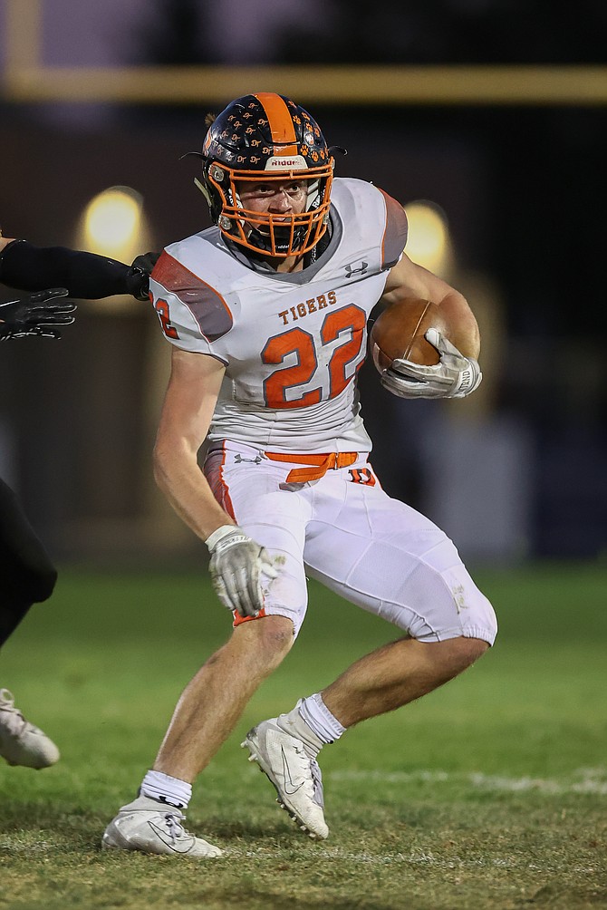 The eyes of Connor Jackson (22) remain focused downfield during his 304-yard rushing performance Friday at Galena. Jackson has 989 yards and 14 touchdowns through six games.