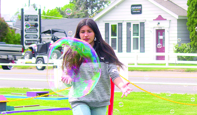 Record-Courier Editor Kurt Hildebrand won the rural Nevada Press Association award for best feature photo for the second year in a row for this photo of Sienna Maita trying to catch a bubble during Family Day at the Carson Valley Museum & Cultural Center in June 2022.