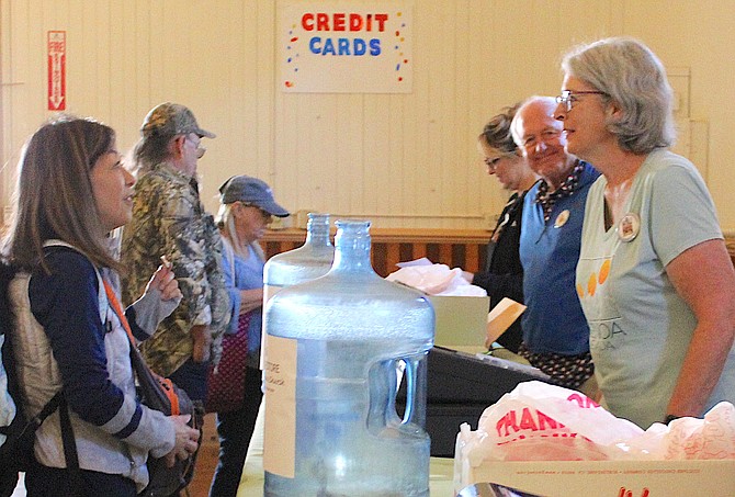 Volunteers sell candy in the Genoa Town Hall during the annual Candy Dance.