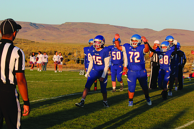 The McDermitt High School football team celebrates is 16-8 win over Owyhee on Thursday in McDermitt.