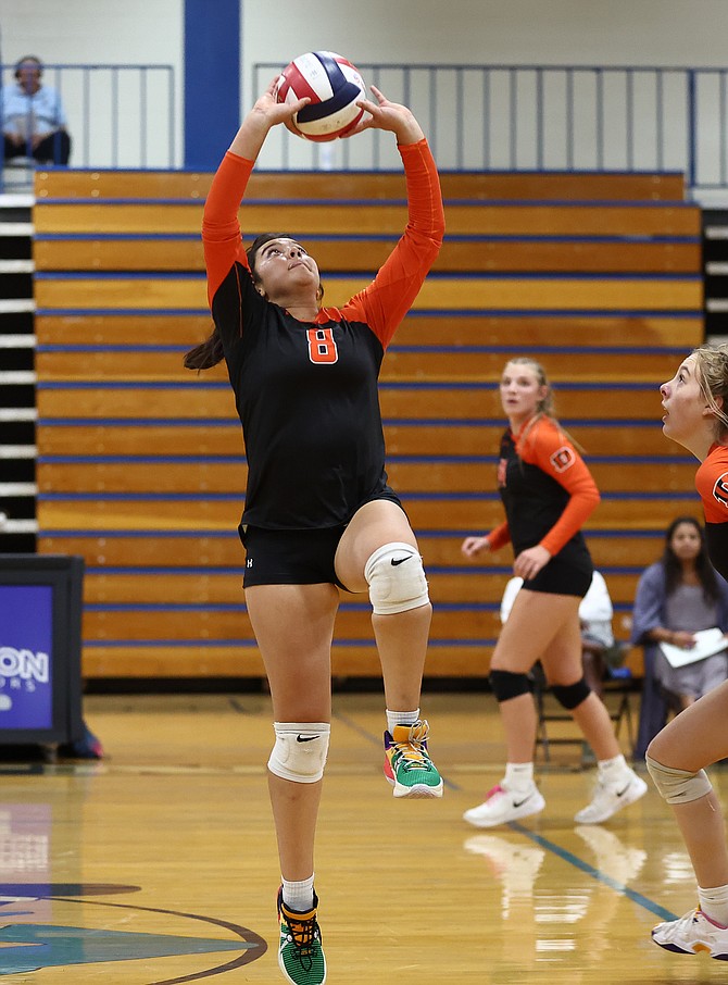 Douglas High’s Priya Kc goes to set the ball during the Tigers’ five-set battle with Carson. The Tigers responded from the loss to the Senators by beating Reed to end last week.