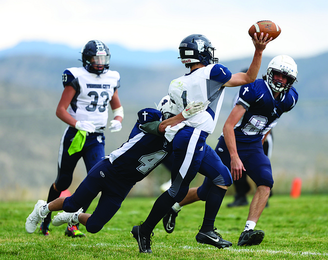 Sierra Lutheran sophomore cornerback Ace Erven goes for a sack against Virginia City over the weekend.