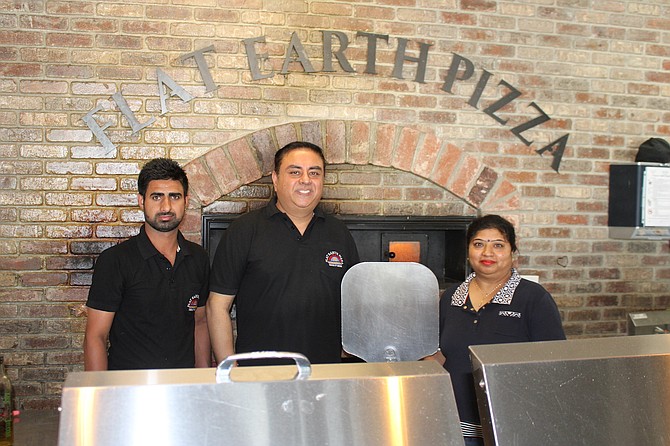 From left, Rahul Kumar, Ram Arora and Dilraj Kaur at Flat Earth Pizza in east Carson City on Oct. 3, 2023.