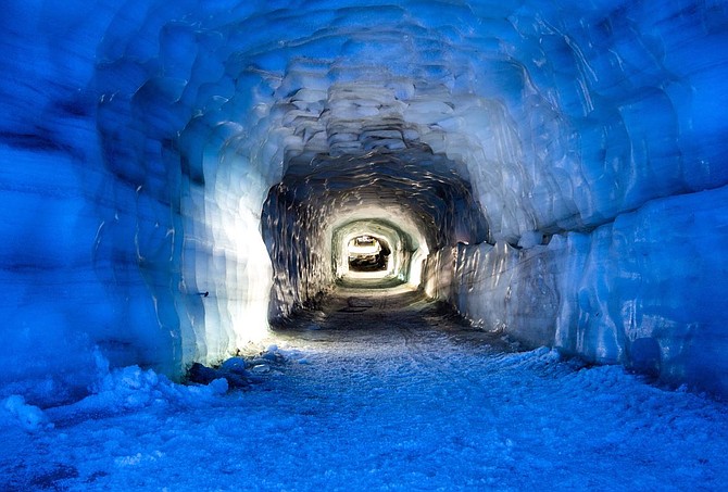 A walk through the largest man-made ice cave carved within the Langjokull Glacier is one of the highlights of the Icelandic Adventure Tour.